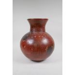 A stoneware vase with sgraffito floral decoration, 33cms high