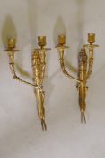 A pair of ormolu Empire style two branch wall sconces, 39cm high