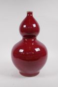 A flambe glazed porcelain double gourd vase, Chinese Kangxi 6 character mark to base, 33cm high