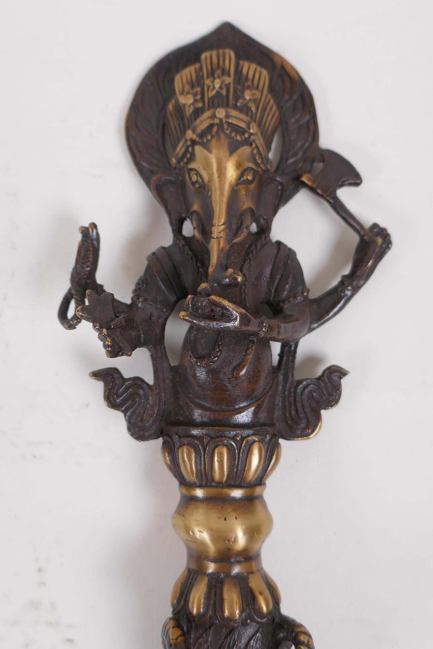 A Tibetan bronzed metal phurba, the handle in the form ofGanesh, 32cm long - Image 2 of 4