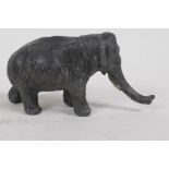 An antique cold painted metal figure of an elephant, 6cm high