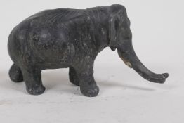 An antique cold painted metal figure of an elephant, 6cm high