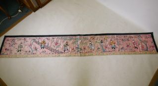 A late C19th/early 20th Chinese silk embroidered pelmet decorated with six immortals in a landscape,