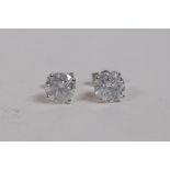 A pair of 18ct white gold and diamond stud earrings, approx 2.1cts