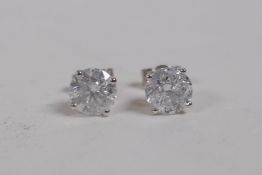 A pair of 18ct white gold and diamond stud earrings, approx 2.1cts