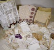 A quantity of good quality lace and linen including table cloths, runners doilies, trimmings etc,