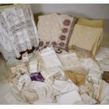 A quantity of good quality lace and linen including table cloths, runners doilies, trimmings etc,