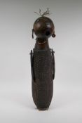 An African basket work and hollowed gourd doll with painted details, possibly Congolese, 59cm high