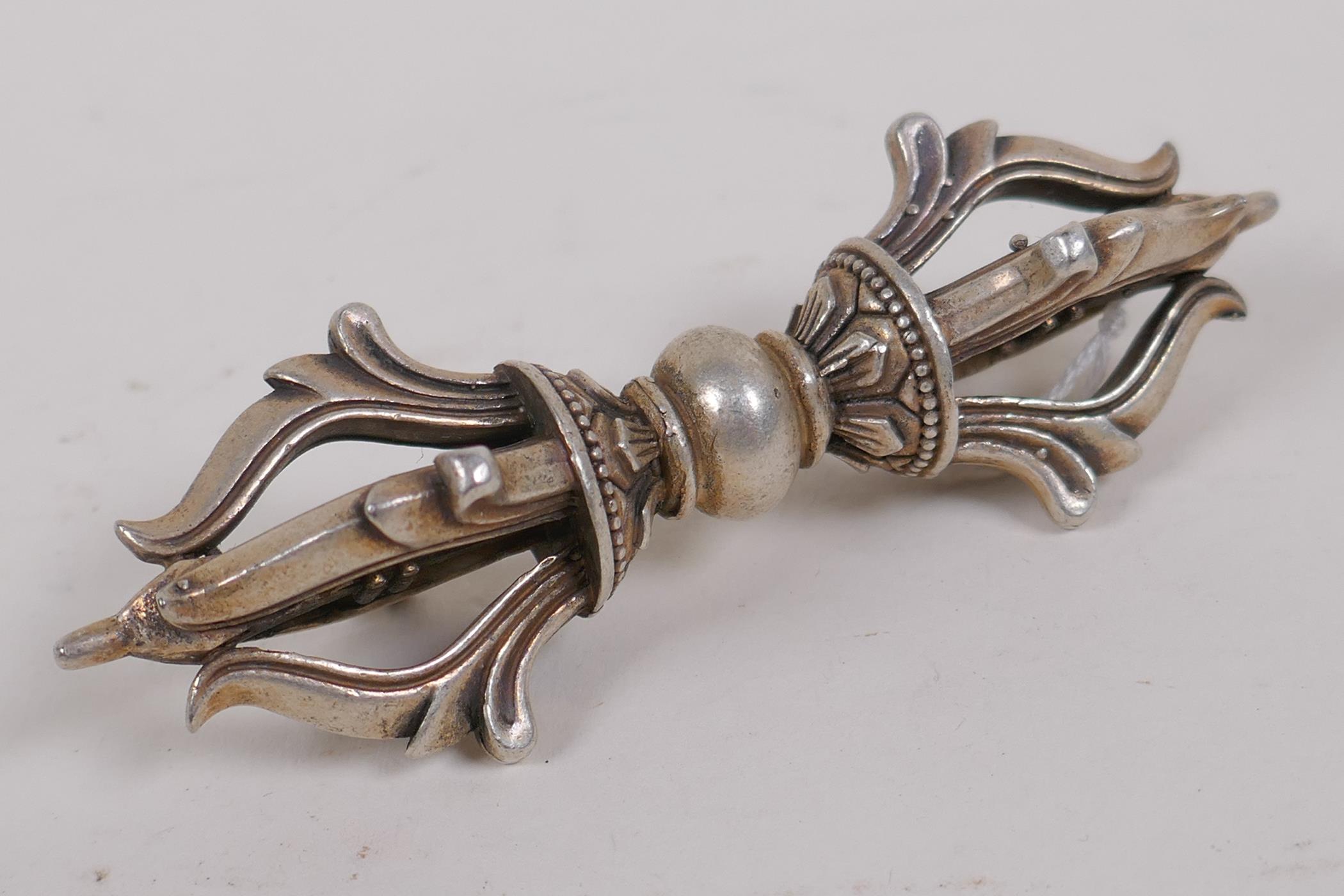 A white metal vajra, 9cm long