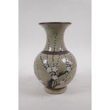 A Chinese celadon glazed porcelain vase with bronze style bands and prunus blossom decoration,