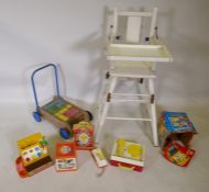 A vintage metamorphic high chair, a vintage Triang baby walker push cart with bricks, and a quantity