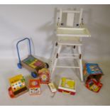 A vintage metamorphic high chair, a vintage Triang baby walker push cart with bricks, and a quantity