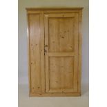 A C19th stripped pine housekeeper's cupboard with single door, adapted, 110 x 30 x 178cms