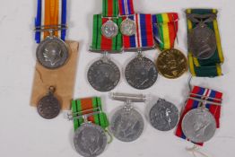 A collection of WWII medals including Campaign and Defence pair with miniatures, French Normandy