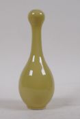 Chinese yellow glazed bud vase, blue circles to base, 17cm high