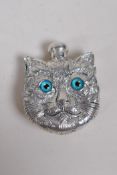 A white metal Louis Wain style perfume bottle in the form of a cat's head, the cover marked 800, 6 x