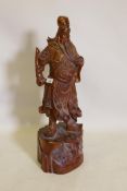 A Chinese carved hardwood figure of an immortal