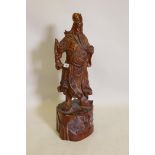 A Chinese carved hardwood figure of an immortal