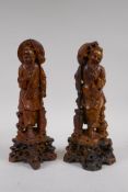 A pair of Chinese carved soapstone figures of fishermen, 29cm high