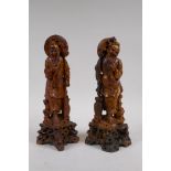 A pair of Chinese carved soapstone figures of fishermen, 29cm high