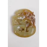 A Chinese celadon hardstone pendant carved in the form of a stylised dragon, 5cm