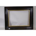 A Victorian picture frame with faux bois decoration and gilt slip, rebate 49 x 64cms