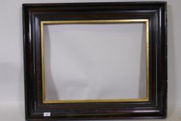 A Victorian picture frame with faux bois decoration and gilt slip, rebate 49 x 64cms