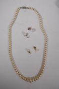 A graduated pearl necklace with 9ct white gold clasp, 45cms long, and two pairs of pearl stud