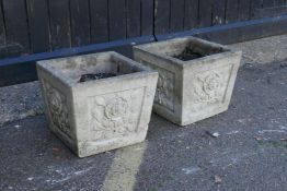 Two concrete square section garden planters embossed with flowers