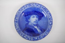 A blue and white Delft charger depicting Rembrandt, marks to the base, AF repairs, 41cm diameter