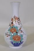 A Chinese porcelain vase with enamel decoration, factory mark and label to base, 25cm high