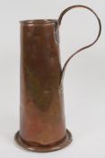 A copper jug engraved with emblem and name of the Sword and Serpent Inn, 34cm high