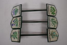 A set of six painted iron herb markers