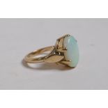 A 9ct yellow gold ring set with a large opal, 4.5g, size L