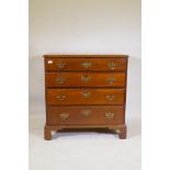 A C19th well figured solid mahogany chest of four long drawers, raised on bracket supports, 92 x
