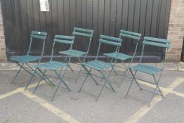 A set of six painted folding garden chairs