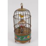 A cloisonne and brass birdcage mantel clock, 17cm high, winder absent