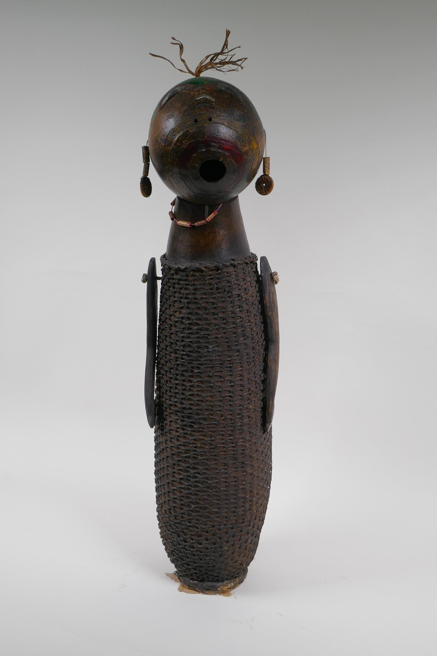 An African basket work and hollowed gourd doll with painted details, possibly Congolese, 59cm high - Image 2 of 3