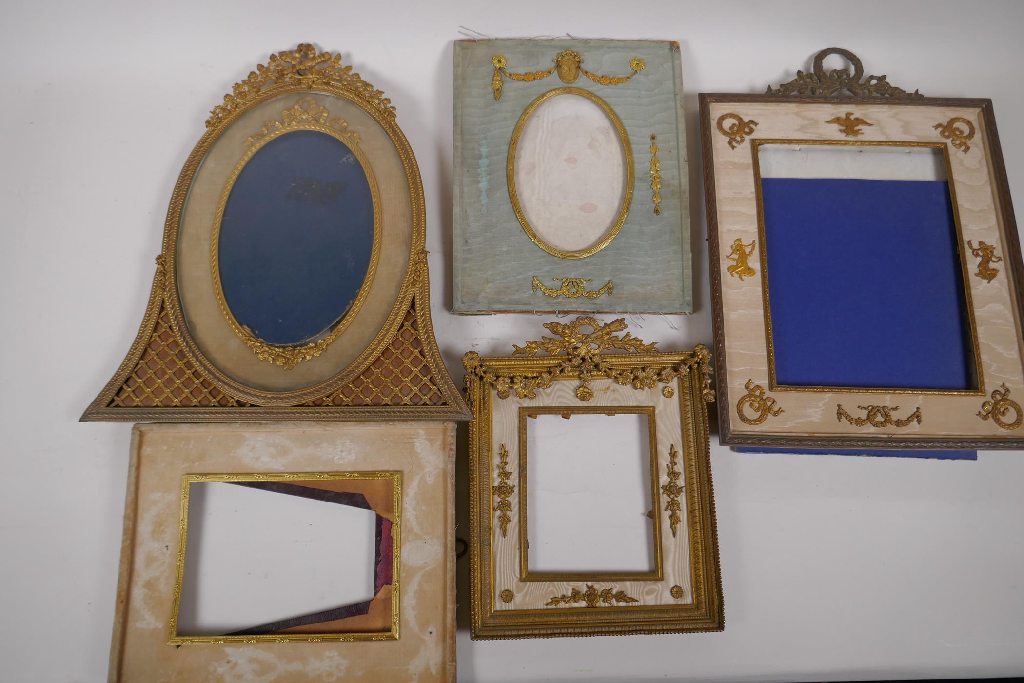 A brass and ormolu photo frame with Empire style decoration and watered silk border, late C19th/