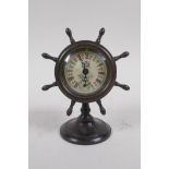 A brass cased desk clock in the form of a ship's wheel, 15cm high