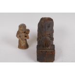 An antique European carved wood votive figure of a lady with bags, 9.5cm high, and an early carved