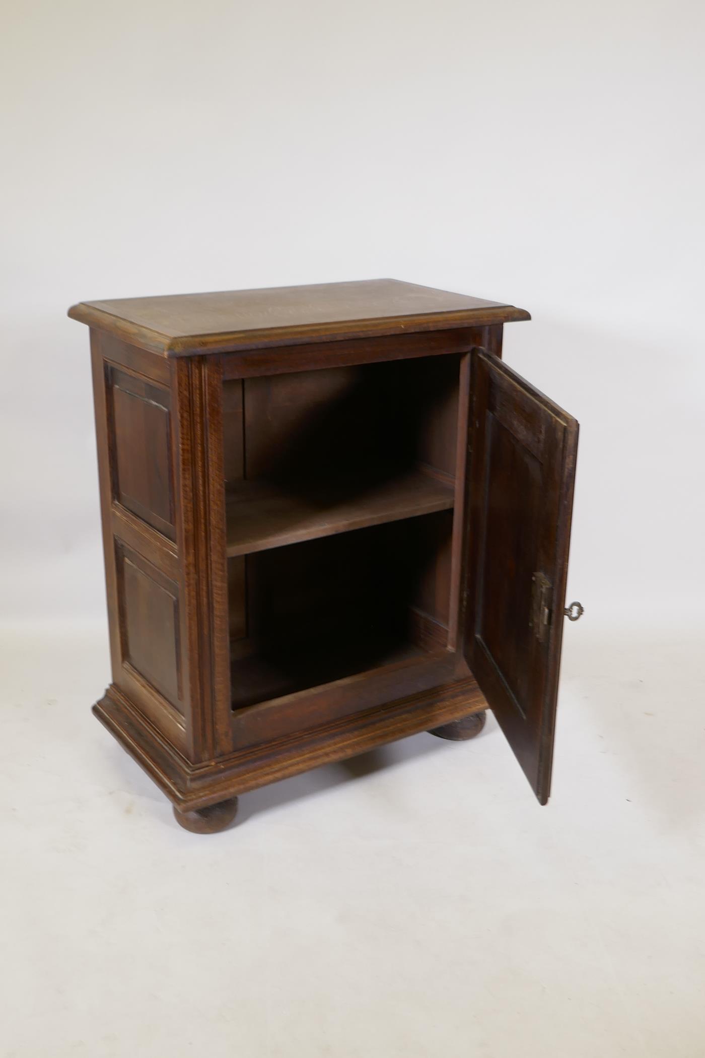 A French oak side cupboard, the single door with moulded decoration, raised on bun feet, 70 x 40 x - Image 3 of 3