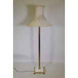 Brass Corinthian column floor lamp with inset marble base, 145cm high, with shade 180cm