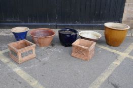 A collection of large ceramic garden planters, largest 49cm diameter, together with a pair of square