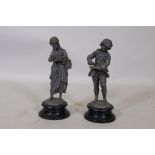 A pair of C19th lead figures, mounted on enamelled metal bases, 33cm high