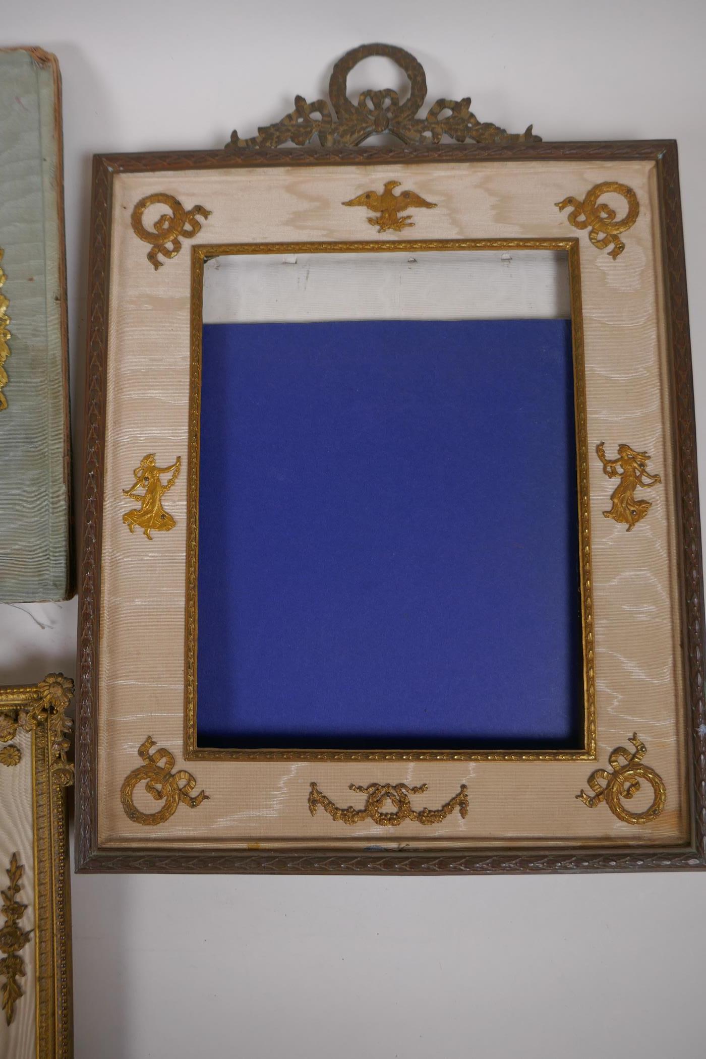 A brass and ormolu photo frame with Empire style decoration and watered silk border, late C19th/ - Image 3 of 5