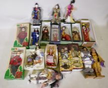 A collection of Japanese and Canadian costume dolls, mostly boxed, largest 40cm high