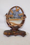 A C19th mahogany swing toilet mirror, with oval mirror and two wells, AF, 85cm high