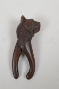 An antique Black Forest bear's head nut cracker, AF, 20cm