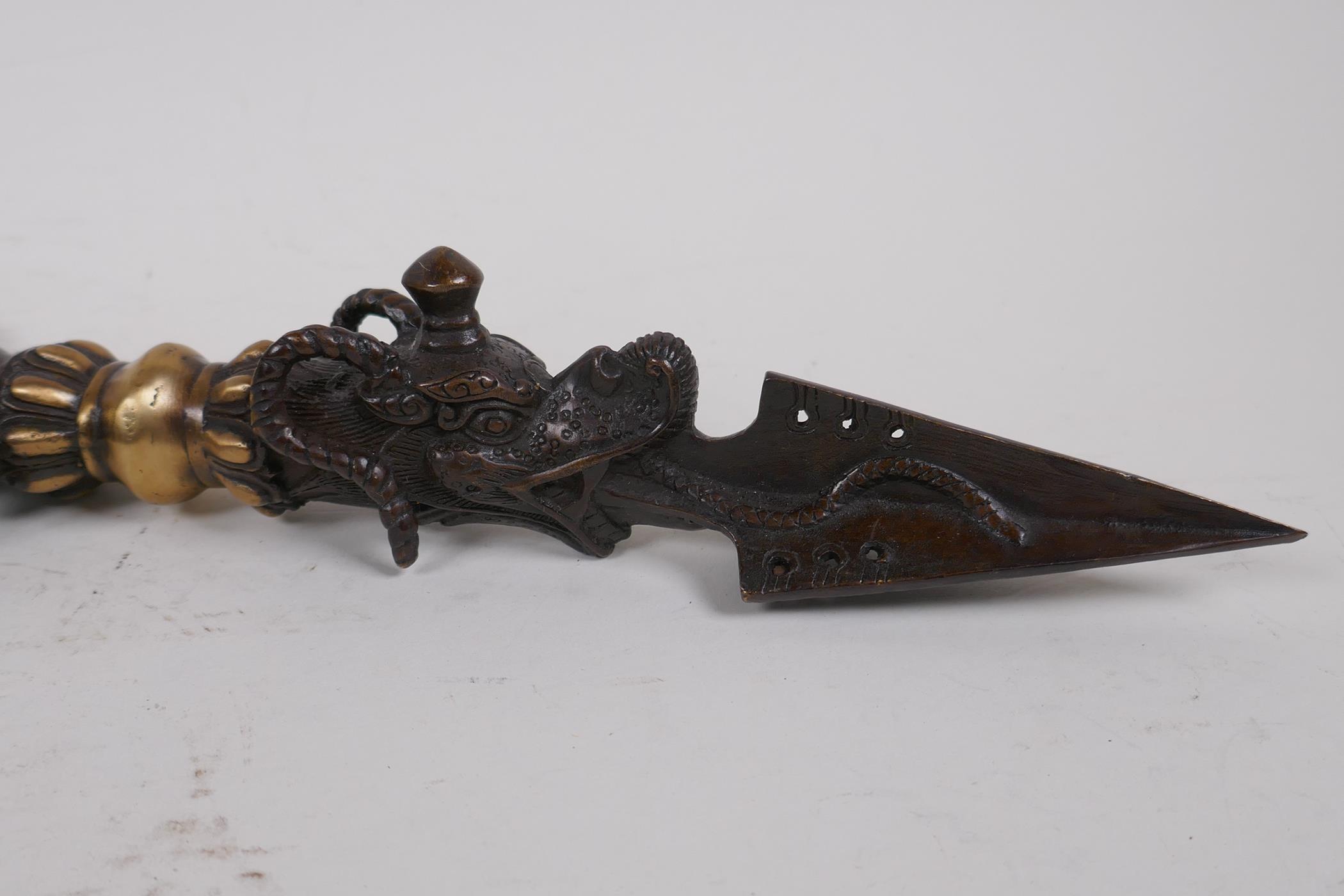 A Tibetan bronzed metal phurba, the handle in the form ofGanesh, 32cm long - Image 3 of 4